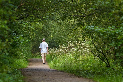 A man walking through Crimdon Dene, near Hartlepool, for a magazine article by Words & Photos. 